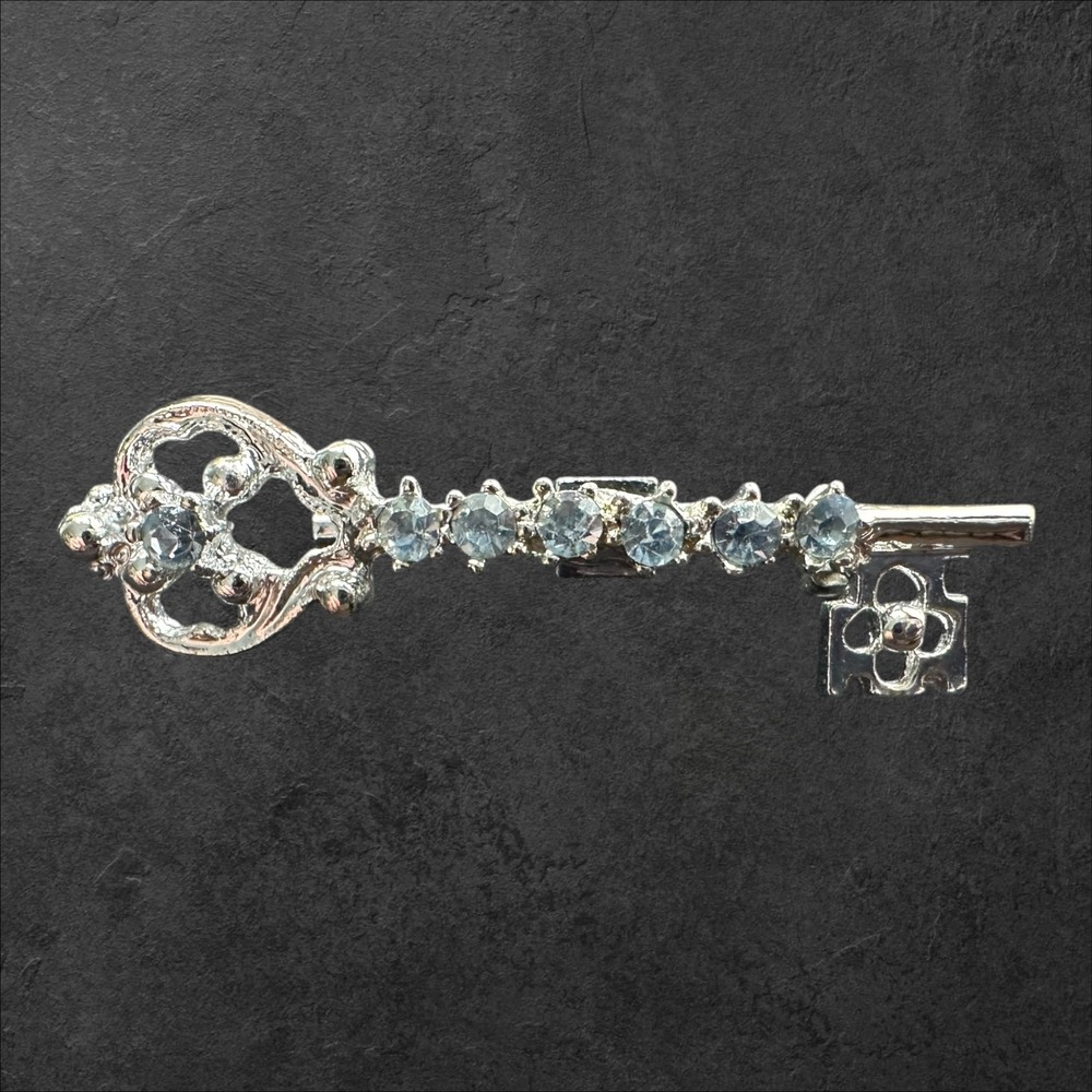 Unmarked Skeleton Key Brooch Silver Tone w/Blue Rhinestone Filigree